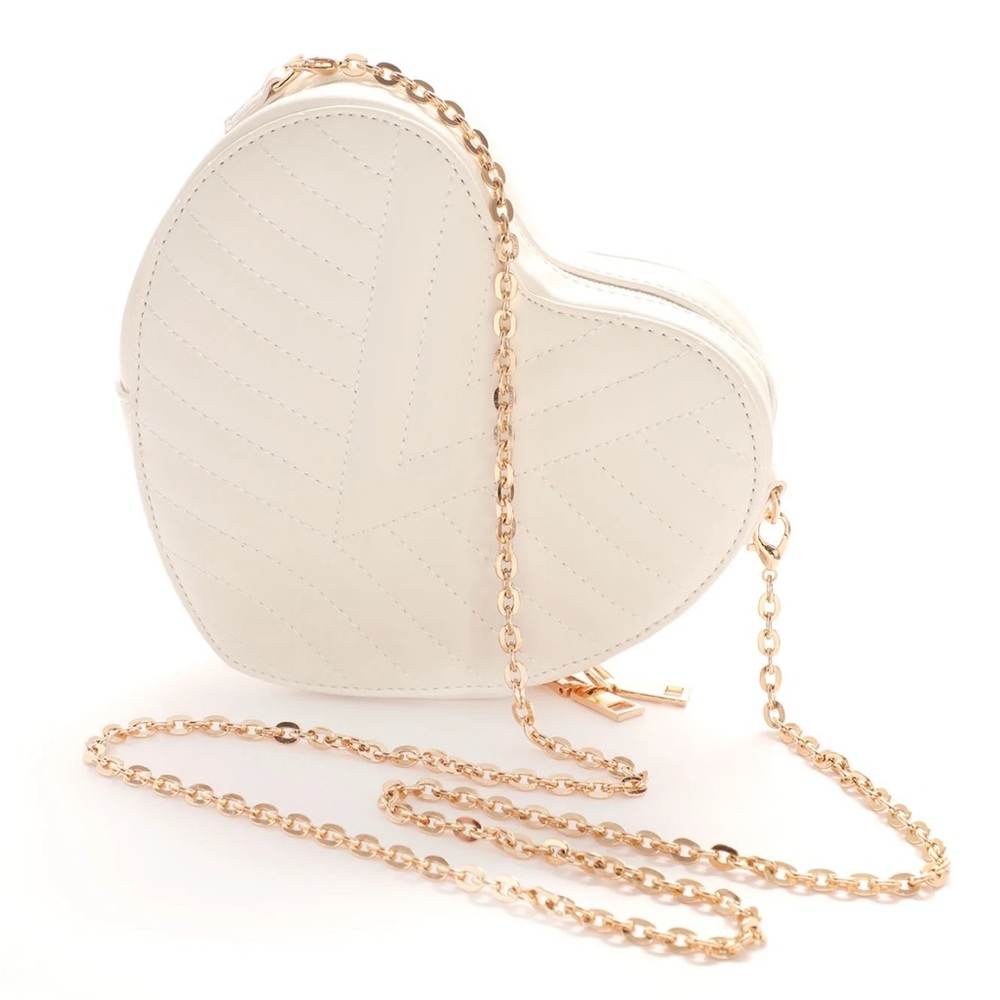 Heart shaped quilted crossbody bag in white